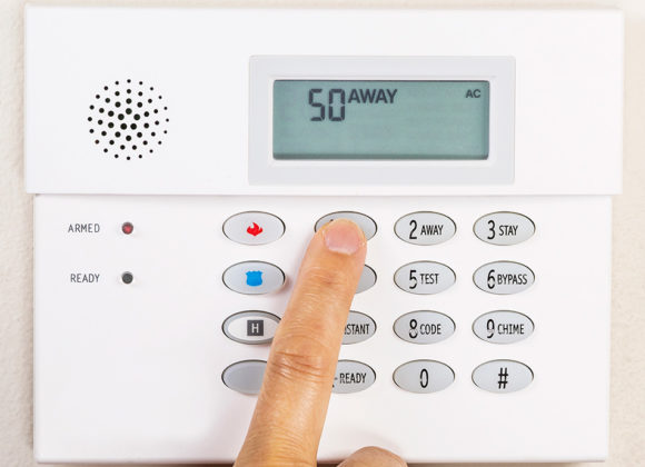 finger using a keypad for Home Security Systems in McAllen, Harlingen, Kingsville, Rockport, TX, Aransas, Alice, TX